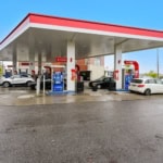 Modern gas station with multiple pumps and convenience store in Ontario.