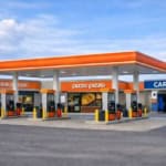 Gas station with convenience store, pizza shop, and car wash facilities in Ontario.